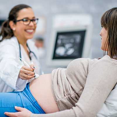 Pregnant woman getting an ultrasound.