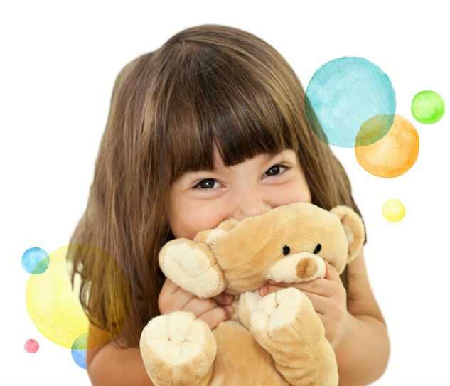 Young girl hugging a teddy bear