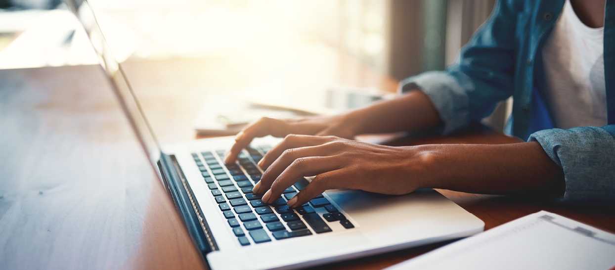 Person working on laptop.