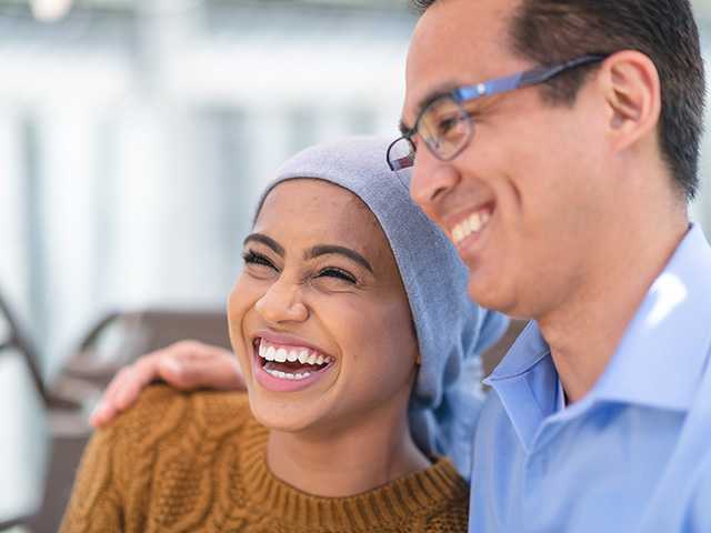 Woman in a scarf with man