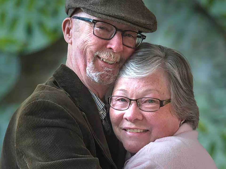Senior man and woman hugging